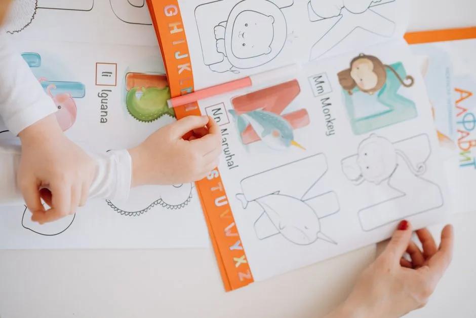 Animal coloring book pages with colored pencils