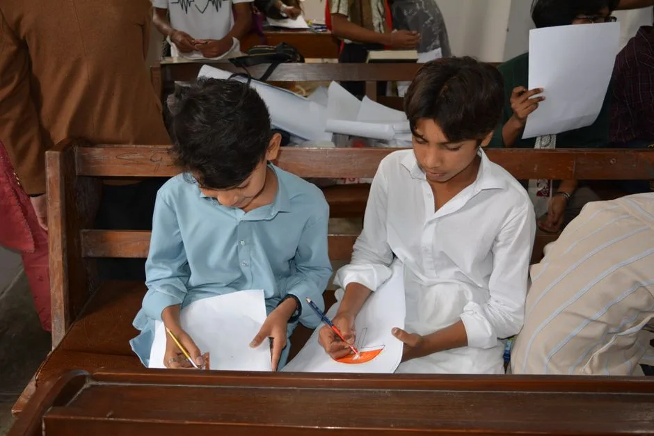 A child working on a Bible word search puzzle in a classroom