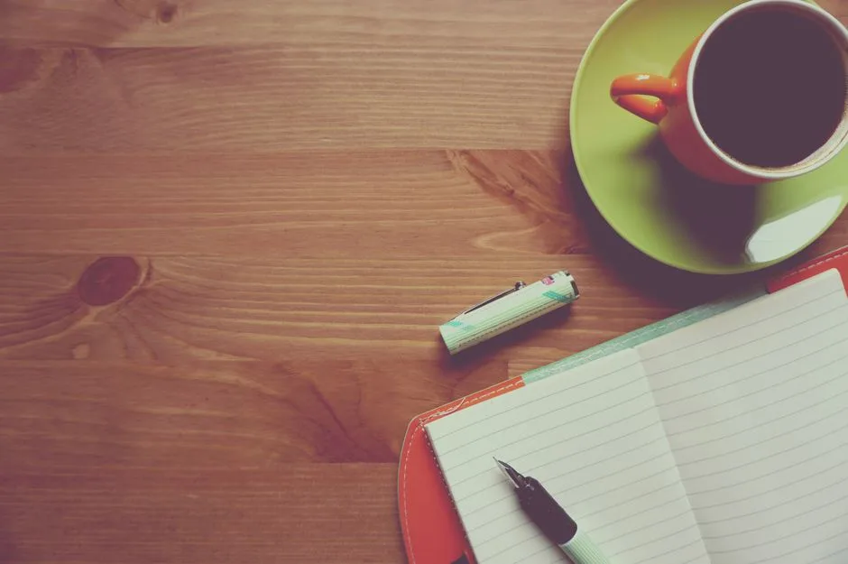 A journal and pen on a quiet desk, putting Scripture into your own words