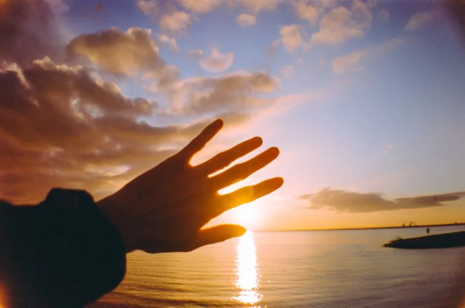 Soft sunrise light over open hands, comfort that replaces anxious thoughts with joy