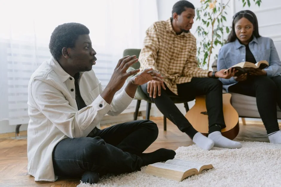 A group of men studying Scripture together, faith sharpened in brotherhood