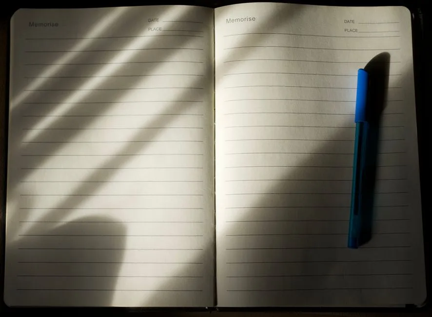 A person sitting quietly with an open journal, close to God in the simple act of writing down their honest prayers