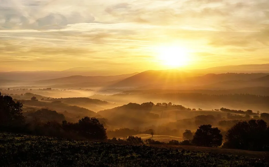 Dawn breaking over a peaceful landscape, the image of restoration Revelation promises to everyone who remains faithful to the very end