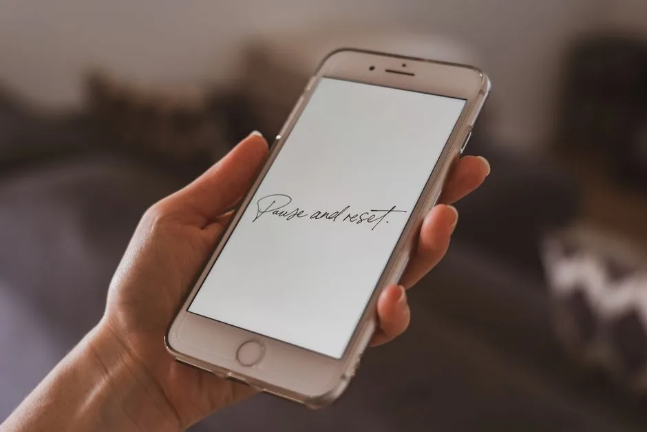 A hand pausing before pressing send — the discipline of thinking before acting