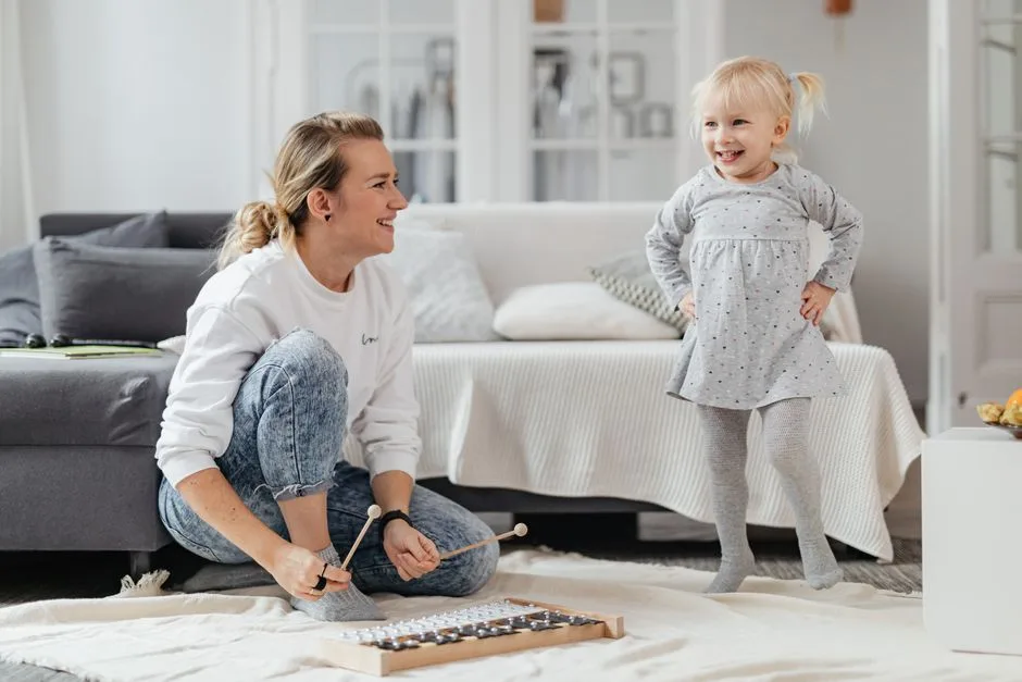 A warm home scene with a mother and child — the quiet, daily strength of motherhood
