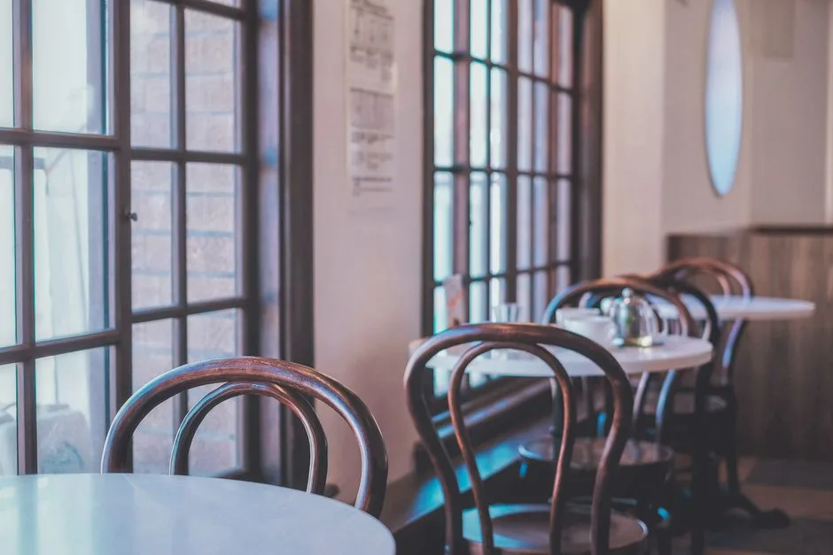 Soft light through a window onto an empty chair — God's nearness in the aftermath of trauma