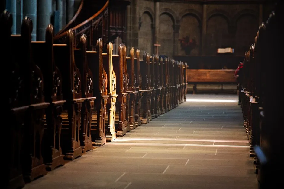 An empty, ornate church pew in soft light — the danger of religious form without substance