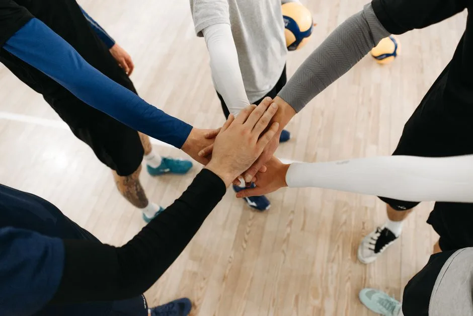 Hands of different people joined together — the radical equality Scripture's trajectory points toward