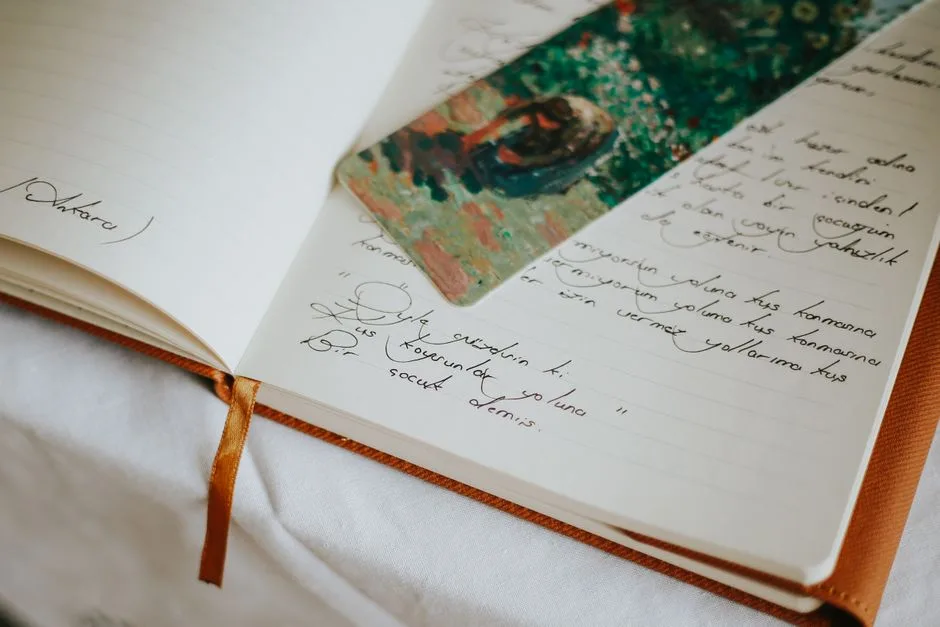 An open journal with handwritten pages — the honest, personal record of God's work in a real life