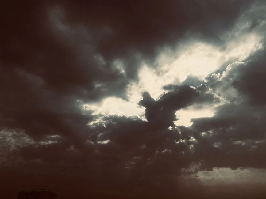 Clouds breaking open with light streaming through — the hope described in this foundational passage