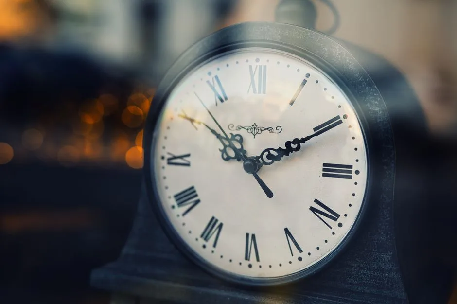 A clock face with hands obscured by light — the unknown timing Scripture says belongs to God alone