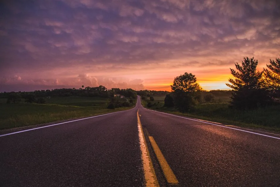A straight road stretching toward the horizon — the path God promises when we stop steering alone