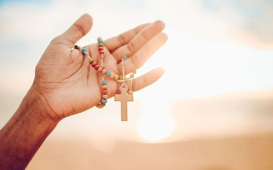 Hands open in prayer at sunrise — bringing worry honestly to God instead of carrying it alone